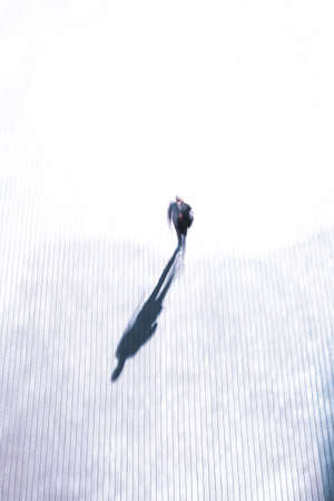 defocused man walking on the street in Bilbao city, Spainの写真素材