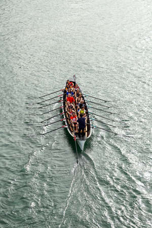 people in canoe, activities and recreation in the bilbao river, Pais Basque, Spainのeditorial素材