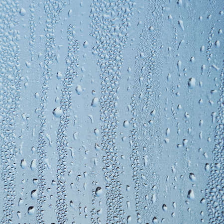 raindrops on the window in rainy days, abstract backgroundの写真素材