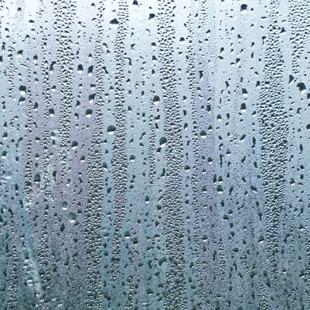 raindrops on the window in rainy days, abstract backgroundの写真素材