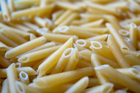 uncooked macaroni pasta, italian foodの写真素材