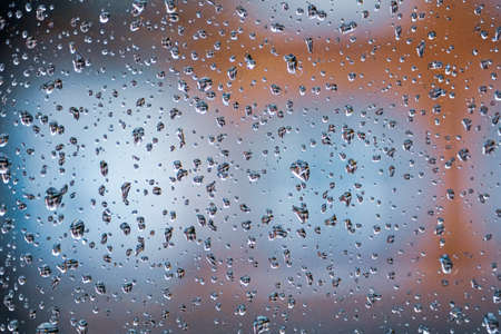 raindrops on the window in rainy days, abstract backgroundの写真素材