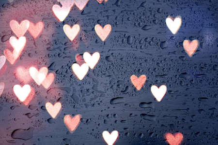 heart shape and raindrops on the window