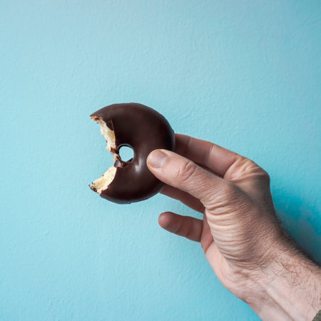 tasty chocolate donut for breakfast, unhealthy foodの写真素材