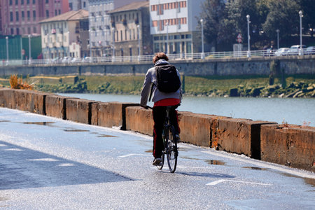 cyclist on the street, bicycle mode of transportation in the cityの写真素材