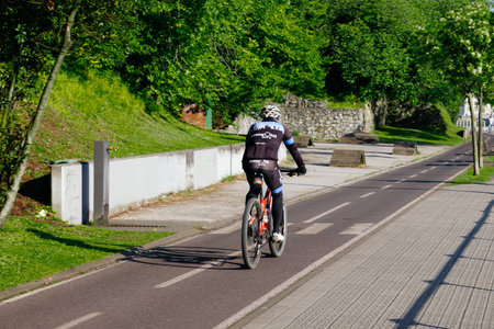 cyclist on the street, bicycle mode of transportation in the cityの写真素材
