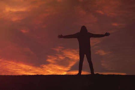 man trekking in the mountain with a beautiful sunset background, Bilbao, Basque country, Spainの写真素材