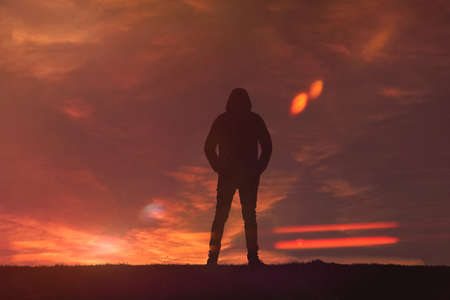 man trekking in the mountain with a beautiful sunset background, Bilbao, Basque country, Spainの写真素材