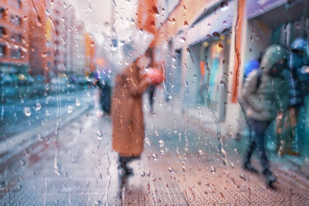 people with an umbrella in rainy days in Bilbao city, basque country, spainの写真素材