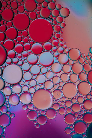 multi colored oil circles on the water, colorful abstract backgroundの写真素材