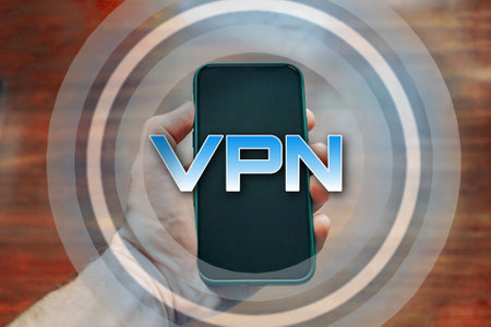 hand holding a smart phone with vpn iconの写真素材