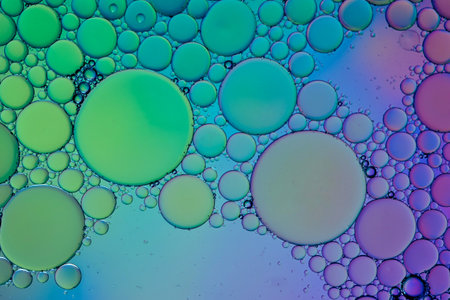 multi colored oil circles on the water, colorful backgroundの写真素材