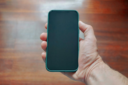 hand holding a smart phone, phone addicted