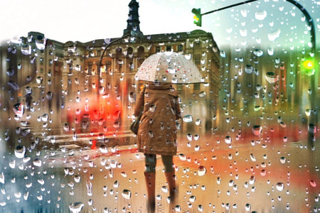 people with an umbrella in rainy days in winter season, bilbao, basque country, spain