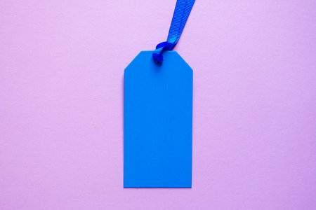 blue price tag on the pink backgroundの写真素材