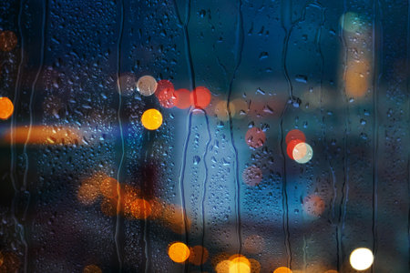 raindrops on the window and Bilbao city backgroundの写真素材