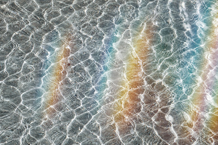 rainbow reflected in the water, abstract backgroundの写真素材