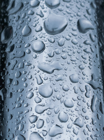 Water drops on a metal surface, close-up. Abstract background.の写真素材