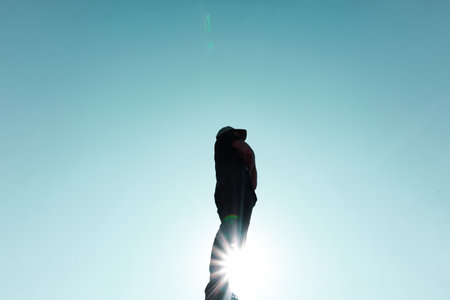 man silhouette portrait trekking in the mountain in summertime
