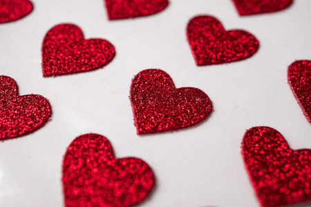 Red hearts on a white background. Valentine's Day. Sees it.
