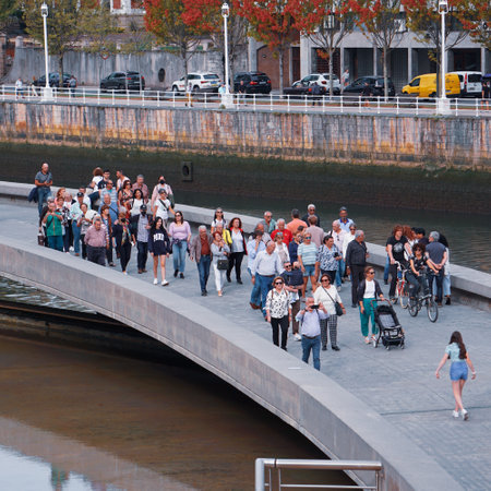 Tourists walk on the Seine river in Paris, France. Paris is the capital and most populous city of France.の写真素材