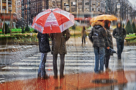 Unidentified people in the rain.の写真素材