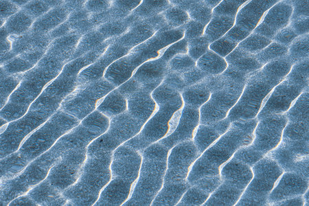 Blue water ripples on a surface. Abstract background and texture for design.の写真素材