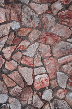 Fragment of a wall from a chipped stone. Background.の写真素材