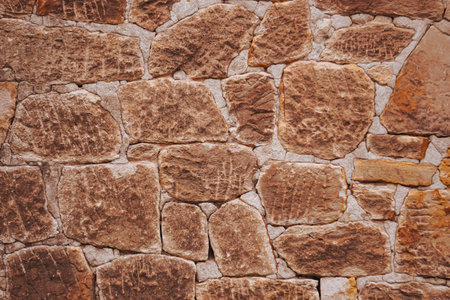 Background of stone wall texture. Old stone wall texture. Stone wall backgroundの写真素材