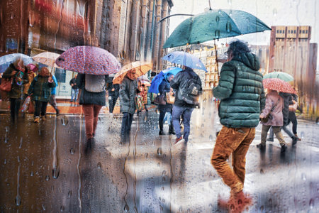 Rainy day in Moscow, Russia. People walking in the rain