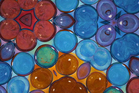 abstract background of colored glass circles on a blue and yellow backgroundの写真素材
