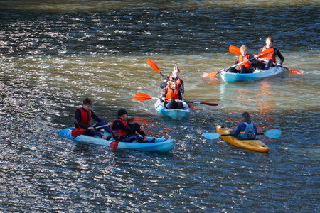 Unidentified people kayaking on the river.の写真素材