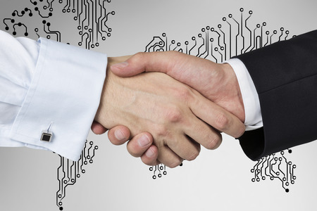 handshake on a world map background