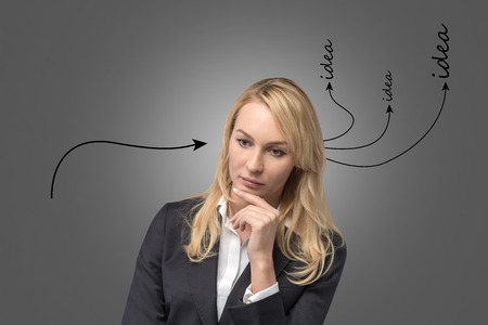 businesswoman with  drawing arrows on head, idea conceptの写真素材