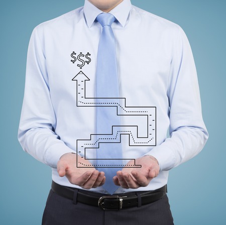 businessman holding labyrinth on a blue の写真素材