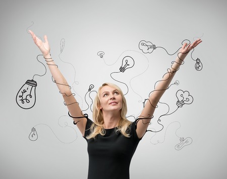 businesswoman with hands raised up, idea conceptの写真素材