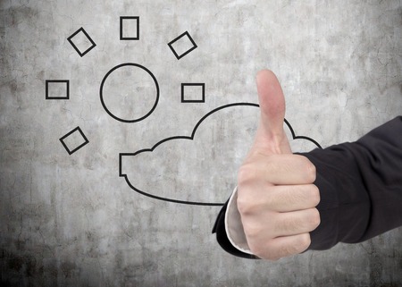 hand showing thumb up symbol, good prognoseの写真素材