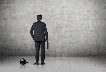 businessman with the weight on the legの写真素材