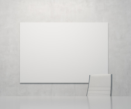 office with big blank poster on wallの写真素材