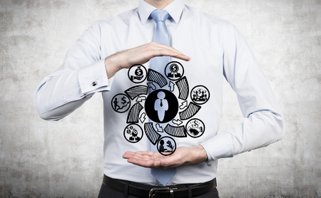 businessman holding drawing business symbol in handの写真素材