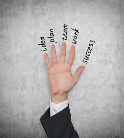 hand up with five fingers  isolation on grayの写真素材