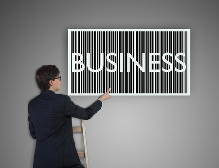 businessman holding drawing business barcodeの写真素材