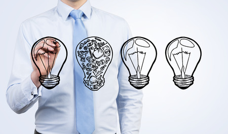 businessman in shirt drawing lamp, idea conceptの写真素材
