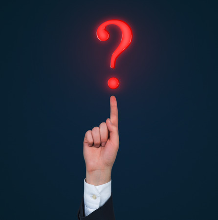 hand pointing to question  mark, close up
