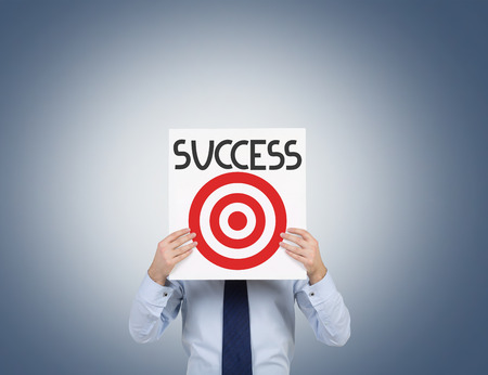 businessman holding poster with target, success conceptの写真素材