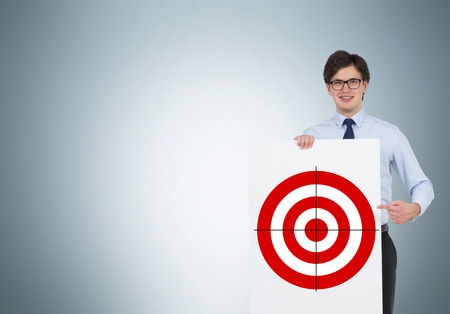 young businessman holding poster with targetの写真素材