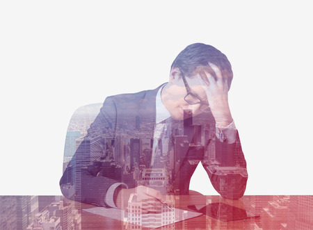 Businessman working in office on a city backgroundの写真素材