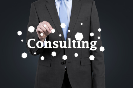 businessman holding drawing consulting symbol on grat backgroundの写真素材