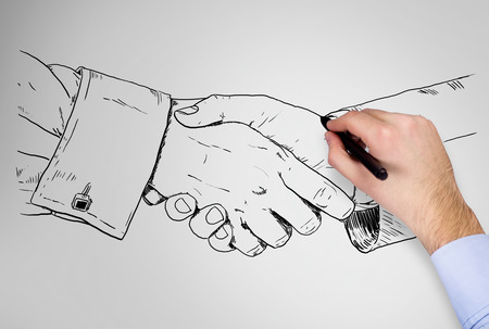 hand drawing handshake on a gray wallの写真素材