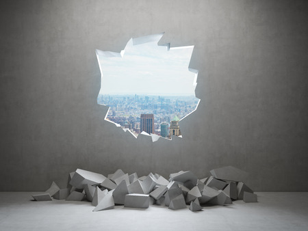 hole in wall to modern cityの写真素材